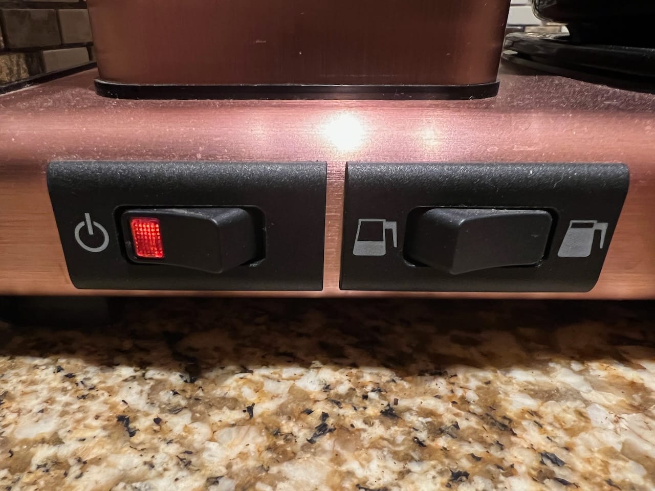 The switch on the right allows you to brew a half or full pot of coffee.